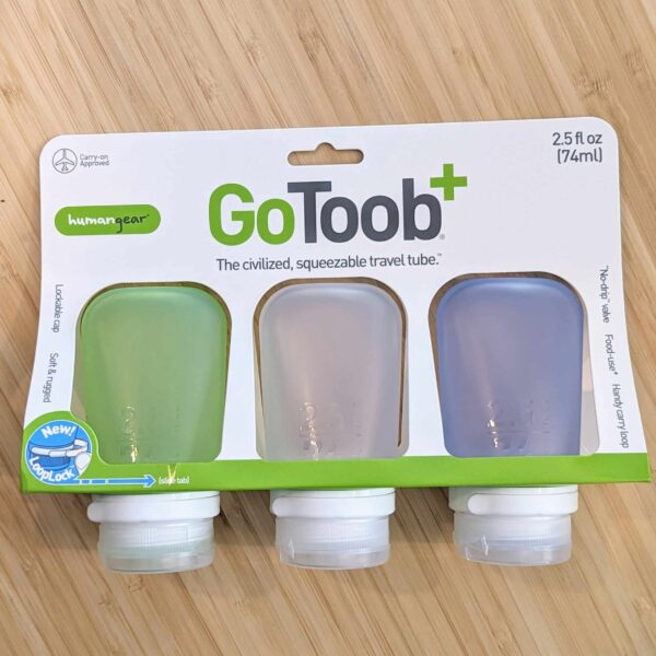 Set of 3 silicone squeeze travel bottles with hard spout in package for low waste living.
