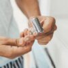 Close up of eco-friendly metal safety razor in man's hands