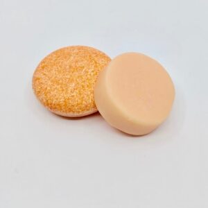 Pink Maverick brand zero waste solid shampoo and conditioner bars in tangerine and lemon scent