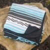 View of recycle, water resistant travel festival blanket in Baja Aqua