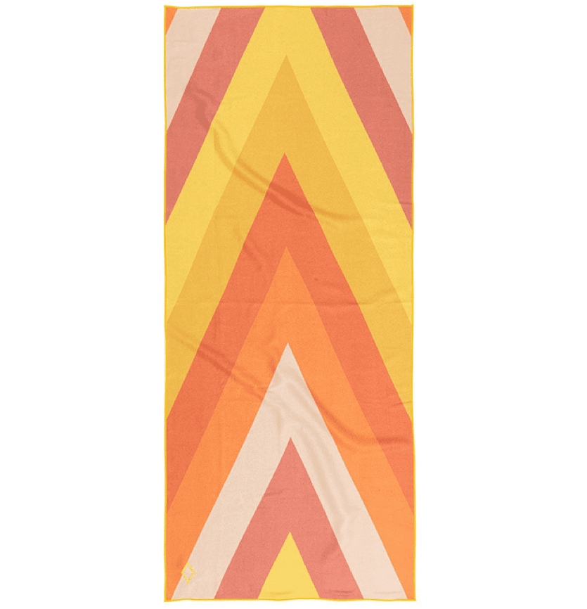 NOMADIX-TOWEL-BEACHYOGA-YELLOW-1 Product display of earth conscious Nomadix brand, yellow and orange pattern, recycled quick drying beach and yoga towel.