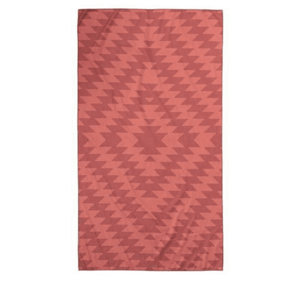 Product display of sustainable Nomadix brand, Mojave Red pattern, recycled ultralight compact travel towel.