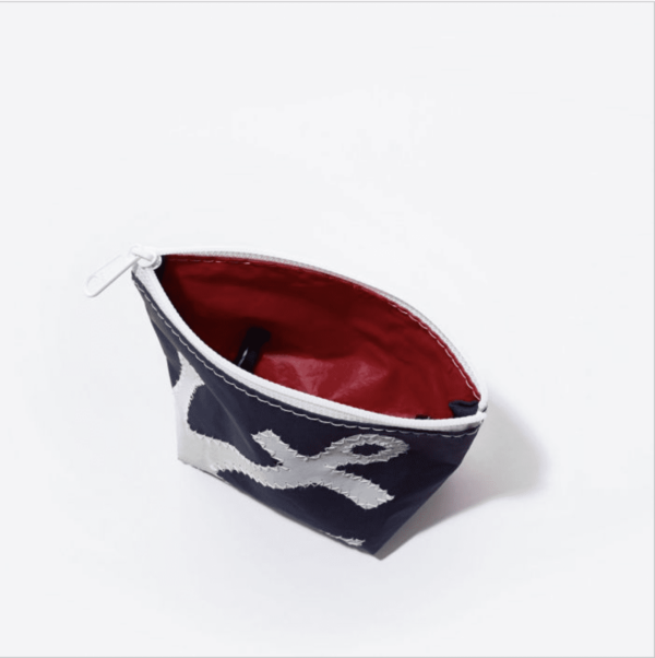 Interior view of Sea Bags brand cosmetic bag with zipper and red interior liner; made from recycled sailcloth and spinnaker cloth.