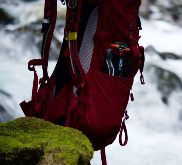 Reusable, collapsible travel water bottle in hiking bag pocket