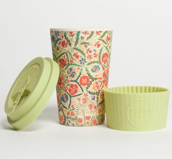 Environmentally friendly E-Coffee Cup brand bamboo fibre coffee cup Papafranco 12 ounce reusable plastic free on the go coffee cup displayed with lid off and hot sleeve next to cup.