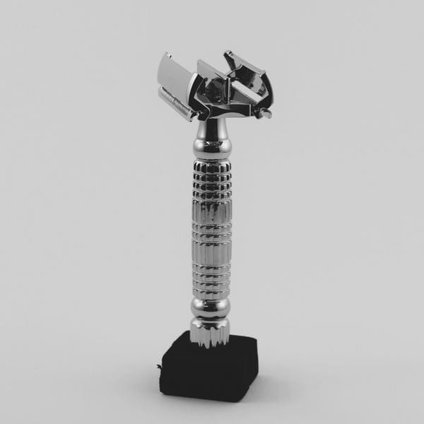 Albatross brand eco friendly plastic-free stainless steel flagship butterfly safety razor standing vertically in open position..