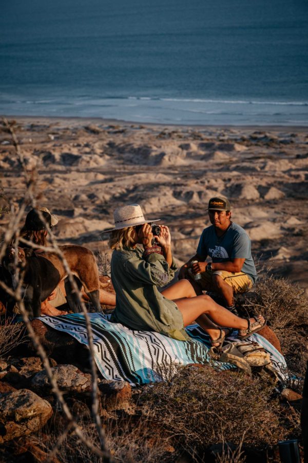 Couple at beach on sustainable Baja Aqua festival blanket and ground mat