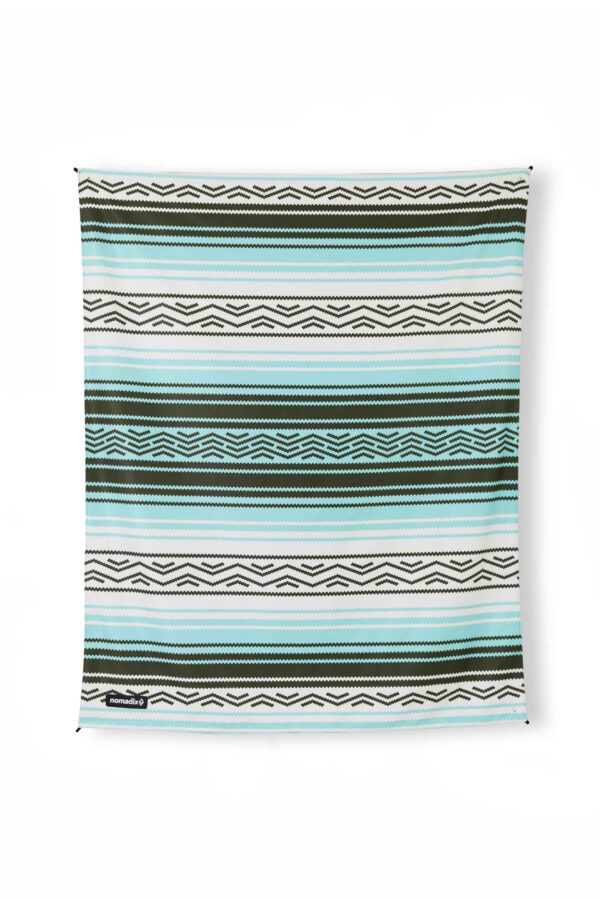 Full view of eco-friendly, packable Nomadix festival blanket in Baja Aqua