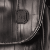 Close up of Alchemy Goods cross body purse showing stitching and AG logo