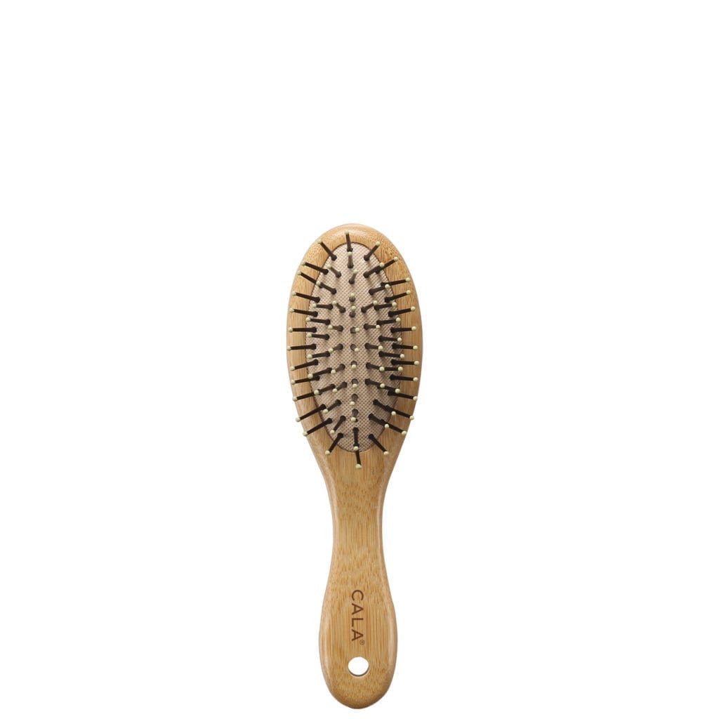 Cala brand travel sized ergonomic wooden bamboo hairbrush with durable bristles.