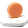 Pink Maverick brand sustainable solid conditioner bar with tangerine and lemon scent