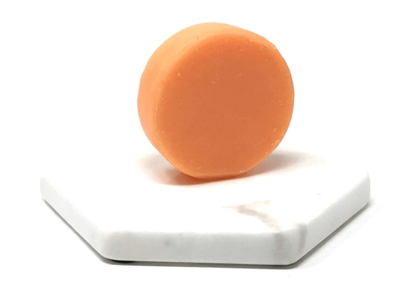 Pink Maverick brand sustainable solid conditioner bar with tangerine and lemon scent