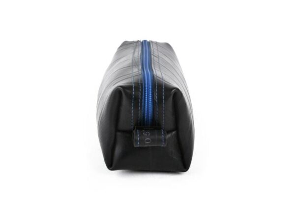 Small dopp kit by Alchemy Goods made of durable upcycled inner tubes; shown in black with blue zipper.