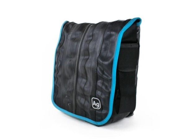 Small shoulder bag by Alchemy Goods made from upcycled bicycle inner tubes; side view to show adjustable shoulder strap.