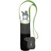 Product display of the Limestone color Chico Bag brand bottle sling bag holding a clear bottle with a folded up bottle sling bag in front to show the minimalist size and style.