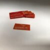 Albatross brand environmentally friendly orange and red razor blade box wrapper.