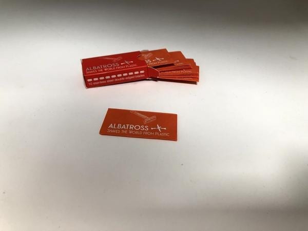 Albatross brand environmentally friendly orange and red razor blade box wrapper.