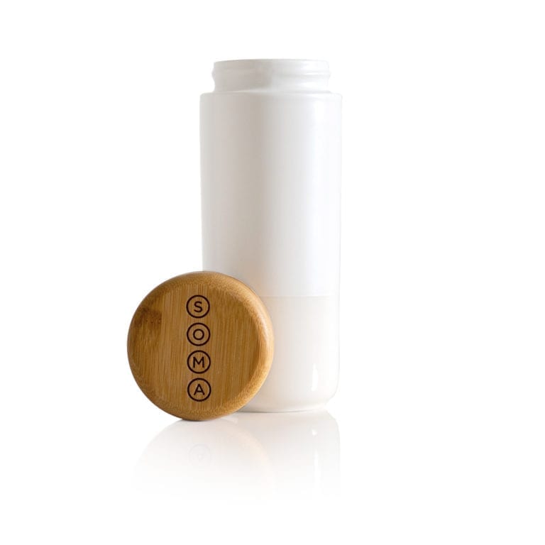 Soma brand eco friendly pearl white insulated ceramic travel mug with branded bamboo cap unscrewed from bottle.