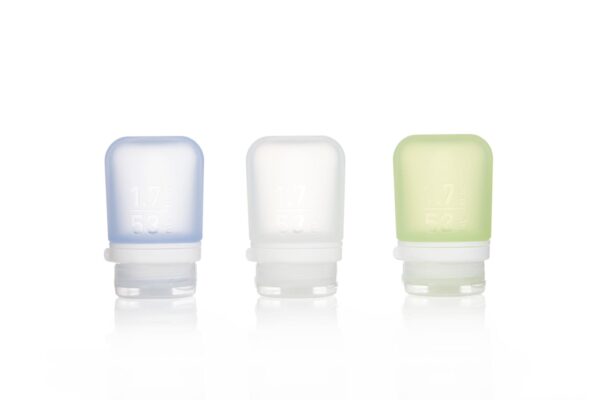 3 pack of eco friendly Humangear brand 1.7 ounce squeezable food-grade silicone travel tubes in blue, clear, and green.