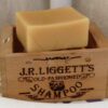 J.R. Liggett's brand sustainable Old Fashioned Shampoo Bar unwrapped on wooden crate.