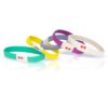 Assortment of five multicolored KOOSHOO brand organic, plastic-free hair ties lying on.