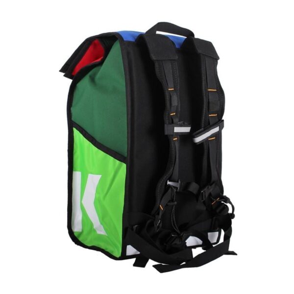 Backside angle view of eco friendly Green Guru Gear brand Joyride 24 liter storm-proof multi-color roll top backpack with black padded shoulder straps made from upcycled materials.