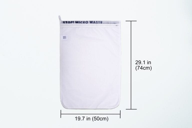 Vertical product display of reusable Guppyfriend brand anti-microplastic laundry bag with dimensions listed - Length: 29.1" Inches Width: 19.7" Inches.