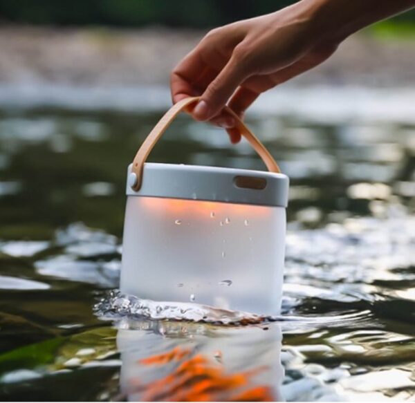 Outdoors with inflatable solar powered light in water