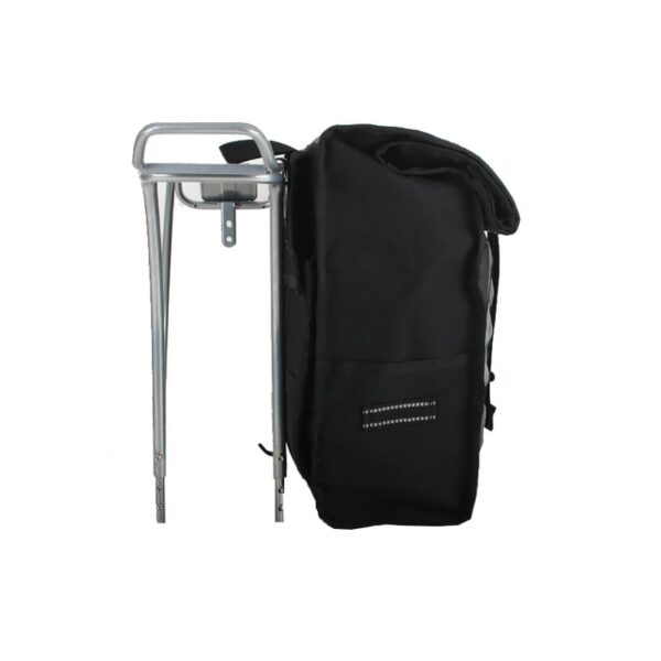Profile display of black High Roller 36 liter backpack convertible pannier displayed next to rear wheel bike rack, is made with inner tubes and other upcycled materials. Product is made by earth friendly Green Guru Gear brand.