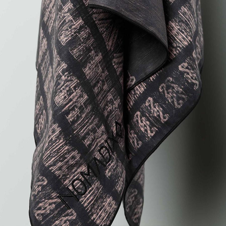 NOMADIX-TOWEL-COMPACTTRAVEL-NIGHTSWELL-2 Earth friendly Nomadix brand, Night Swell pattern, recycled ultralight compact travel towel hanging on wall hook.