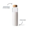 Product feature photo of environmentally friendly Soma brand glass water bottle, has a wider mouth that will fit ice cubes and the stable base.
