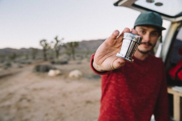 Model showing off his Mizu brand collapsible two ounce stainless steel shot glass