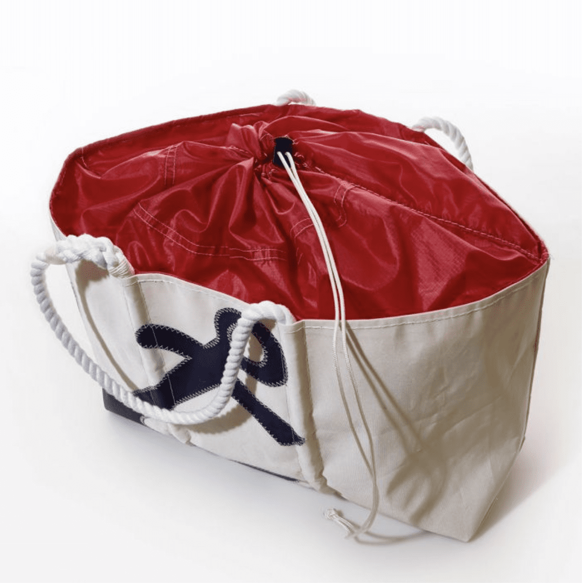 SEABAGS-EXPANDABLETOTE-NAVYANCHOR-3 Sea Bags brand large expandable tote in white with blue anchor design; additional fabric at top of bag is red and features drawstring to secure items in bag