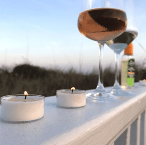 Murphy's Naturals brand mosquito repellent tea light candles shown being used on an outside patio