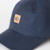 Close-up of blue bill and blue front panels of Ten Tree brand baseball cap