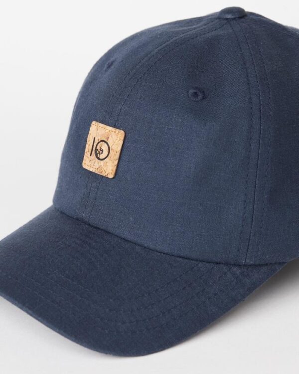 Close-up of blue bill and blue front panels of Ten Tree brand baseball cap