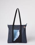Ten Tree brand daily tote bag in dark blue with a waves print; made with REPREVE fabric and BLOOM foam padding