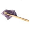 The Dirt brand eco friendly Bamboo Toothbrush on a decorative geode.