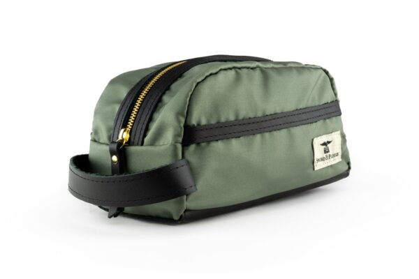 Side view of the Sword & Plough repurposed U.S. Air Force Fabric travel dopp kit in green