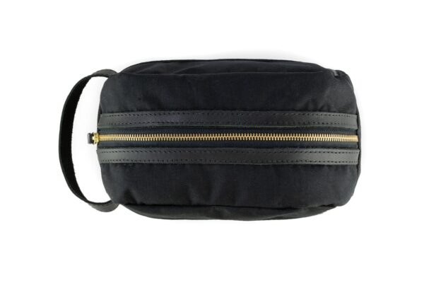 Sword & Plough dopp kit made of repurposed U.S. Marine Corps uniform material with gold zipper enclosure