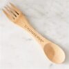 Overhead view of eco friendly reusable U-Konserve brand bamboo wooden spork utensil.