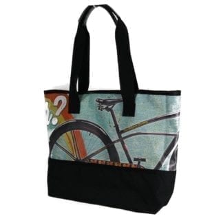 Large tote bag made of upcycled advertising banners from Alchemy Goods; shown with bicycle print
