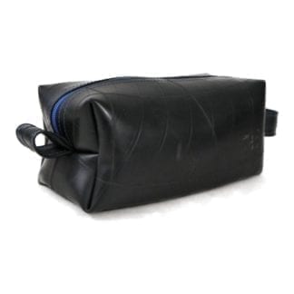 Large dopp kit by Alchemy Goods made of durable upcycled inner tubes; shown in black with blue zipper.