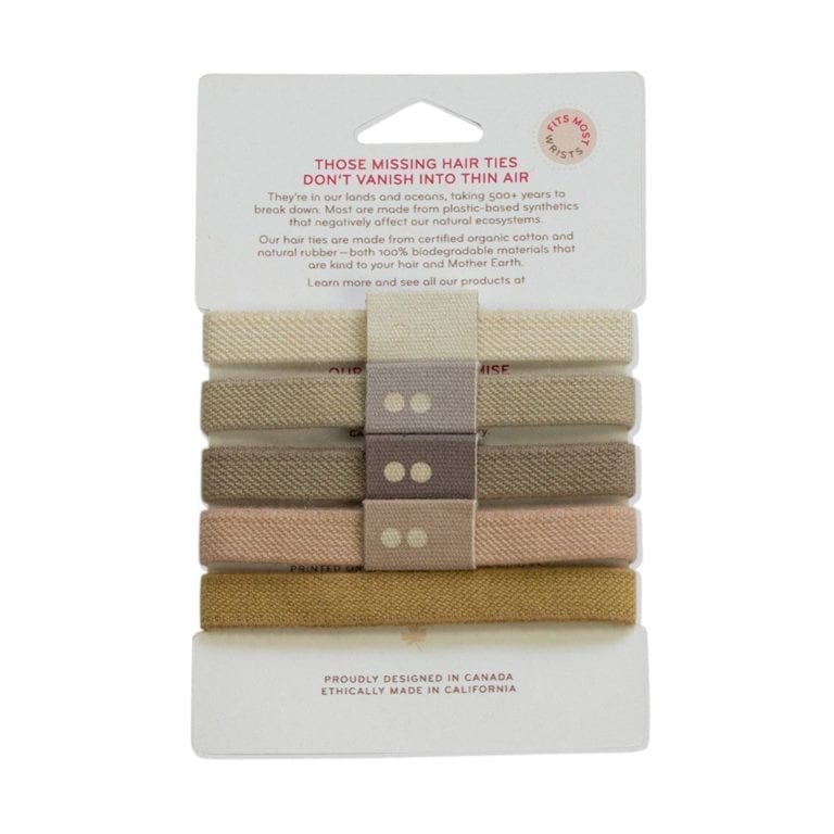 Backside of sustainable packaging for an assortment of five different blonde colored KOOSHOO brand organic plastic-free hair ties on a rectangular cardboard sleeve.