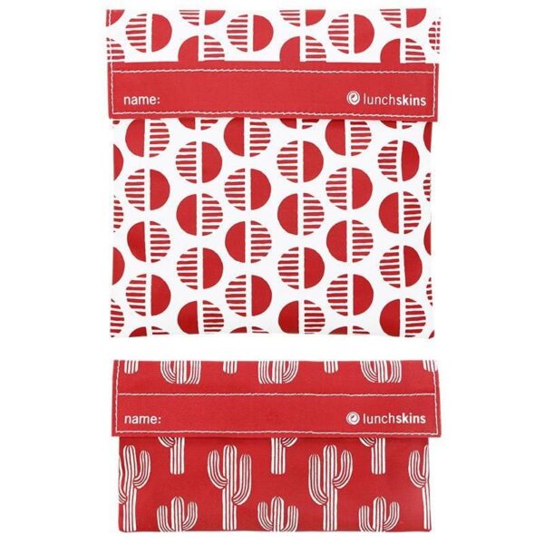 Two pack of Lunchskins brand reusable food bags shown in red fabric with desert sun and cactus patterns