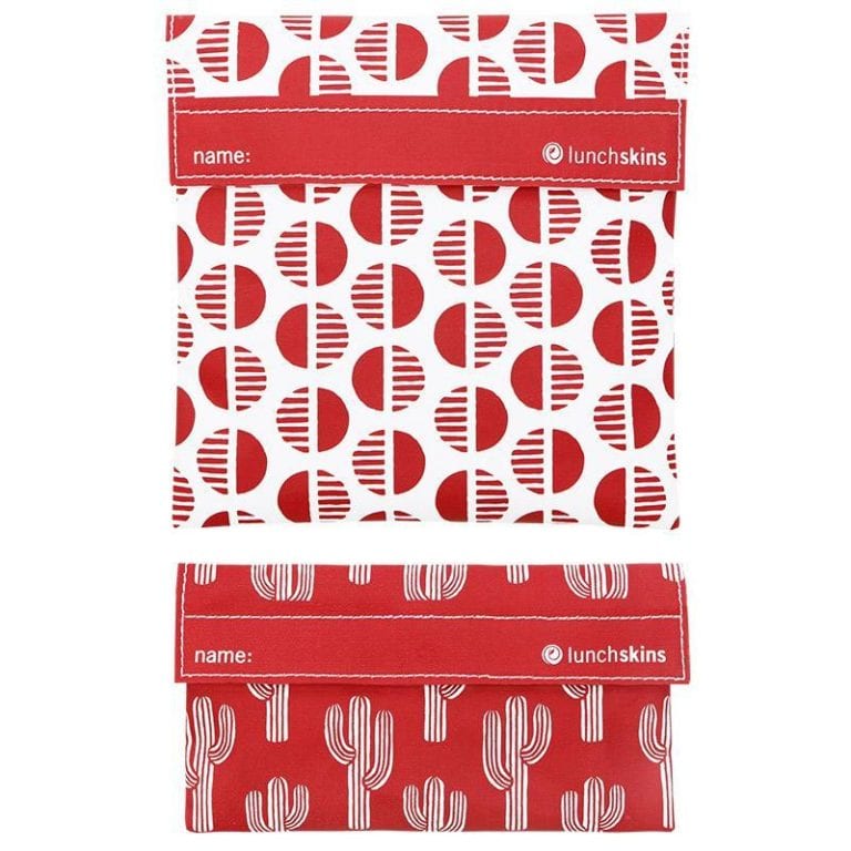 Two pack of Lunchskins brand reusable food bags shown in red fabric with desert sun and cactus patterns