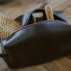 Large dopp kit by Alchemy Goods shown with open zipper; can hold many toiletry items for your travel needs.