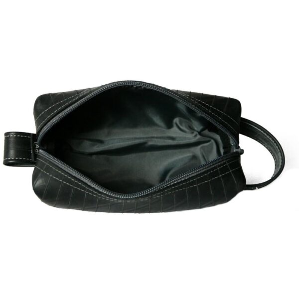 View of small dopp kit from above to show black zipper and black interior lining.