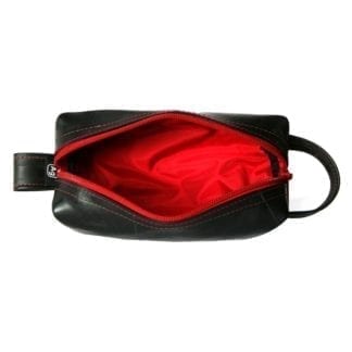 View of small dopp kit from above to show red zipper and red interior lining.