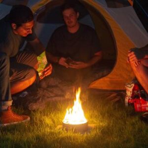 Four friends camping around Radiate Recycled Portable Campfire
